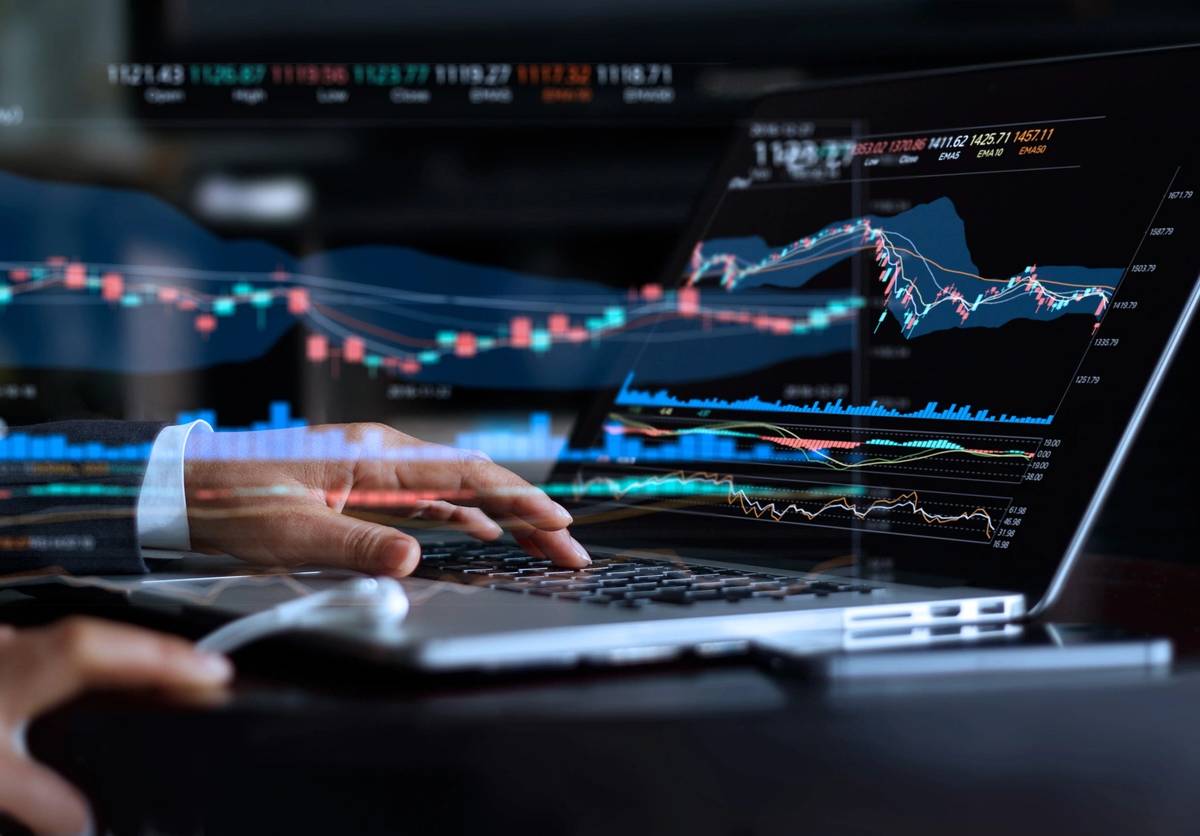 laptop with data and graphs