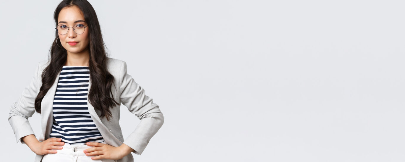 Business, finance and employment, female successful entrepreneurs concept. Confident businesswoman in glasses and white suit ready for meeting, smiling pleased, standing determined.